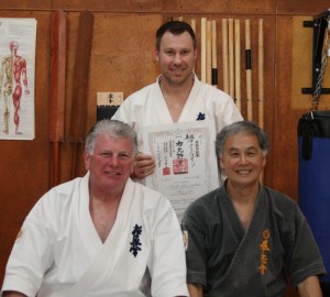 Sensei Mark Shelmerdine is awarded his 3rd Dan in Kobudo by Sensei Hokama and Shihan Lipman, September 2012