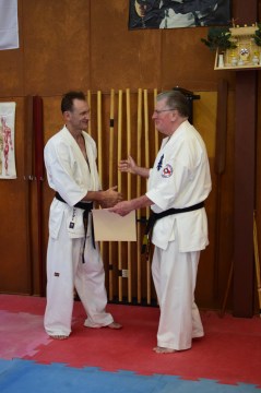 Shihan Howard Lipman awards Shihan Peter Olive his 5th Dan in Kyokushin.